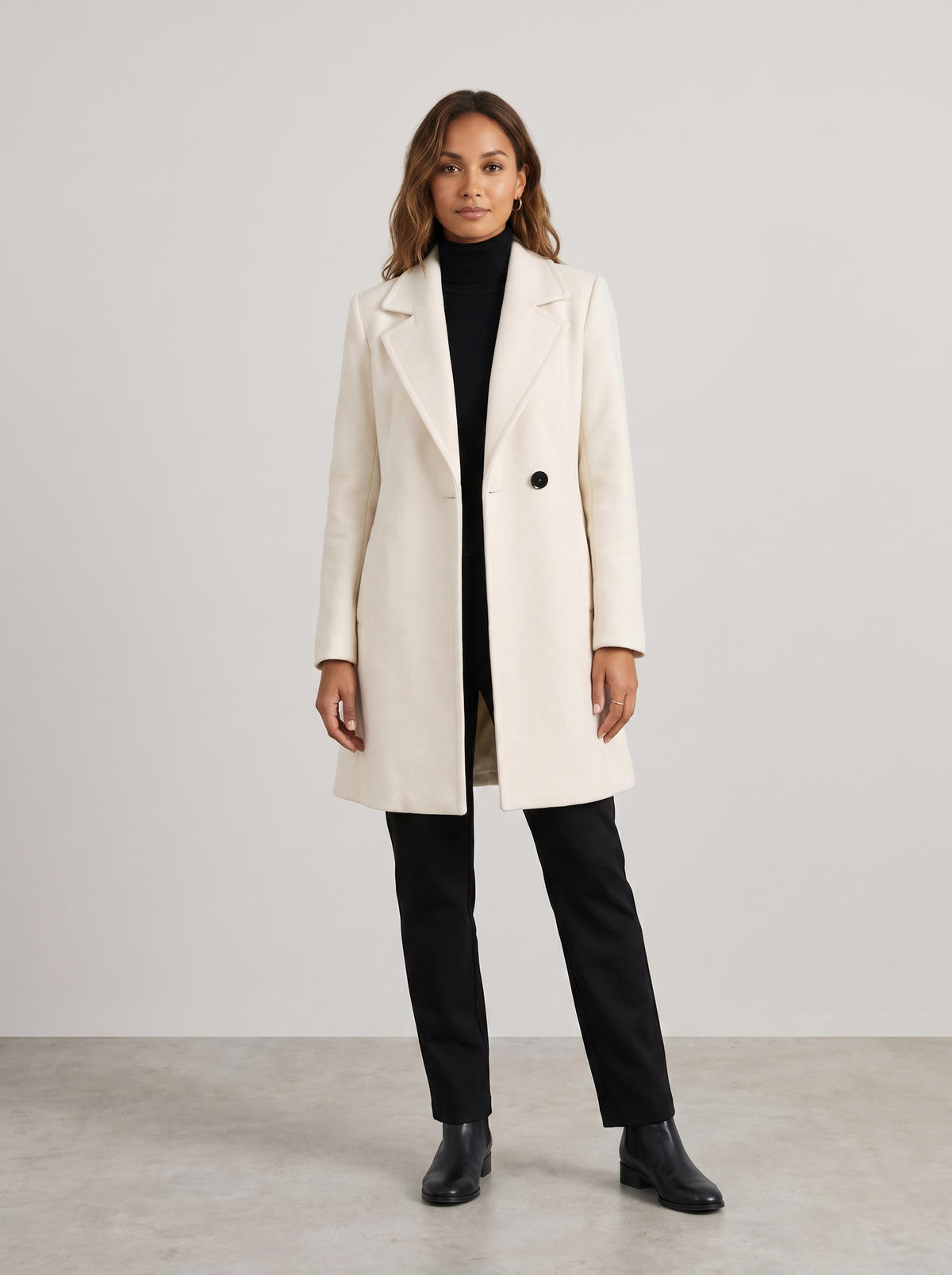 Adeline | Women's Elegant Coat in cream, worn by a model, full-length studio photo