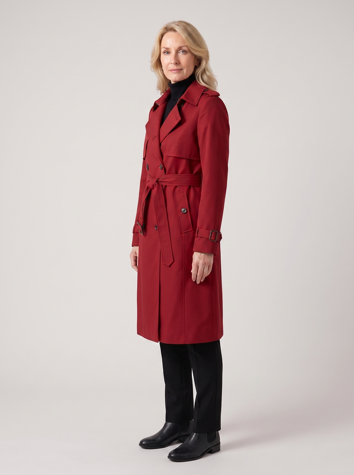 Natalia | Women's Classic Long Trench Coat in red, side three-quarter view, studio photo
