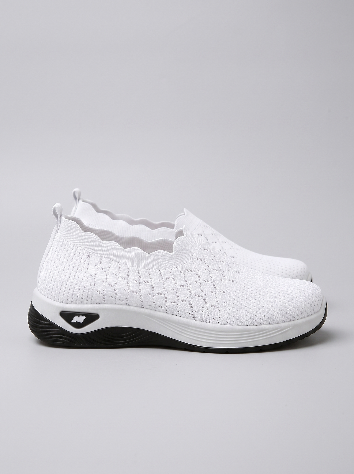 Remi Women's Ultra-Light Slip-On in white, side profile view