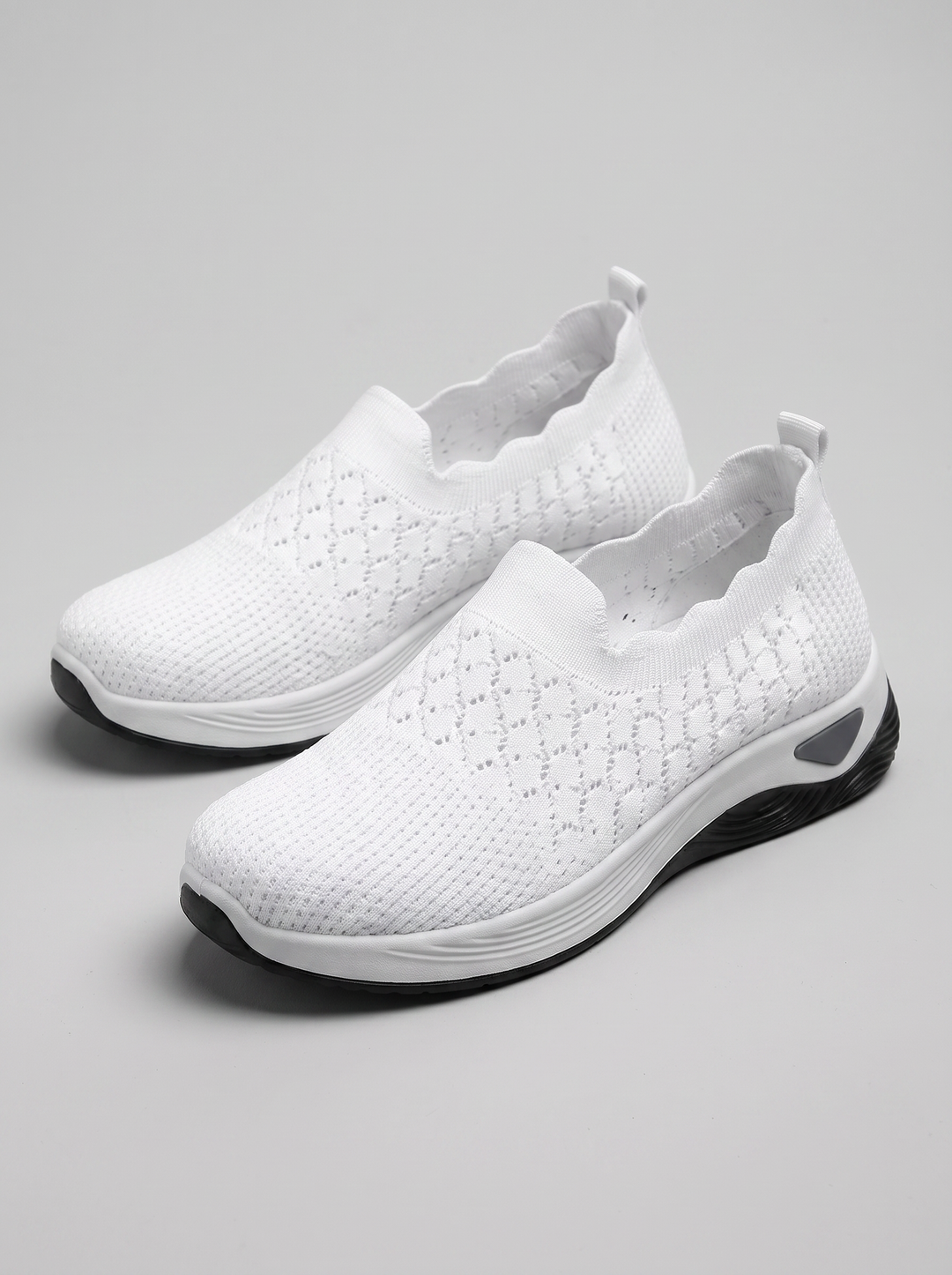 Remi Women's Ultra-Light Slip-On in white, three-quarter front view