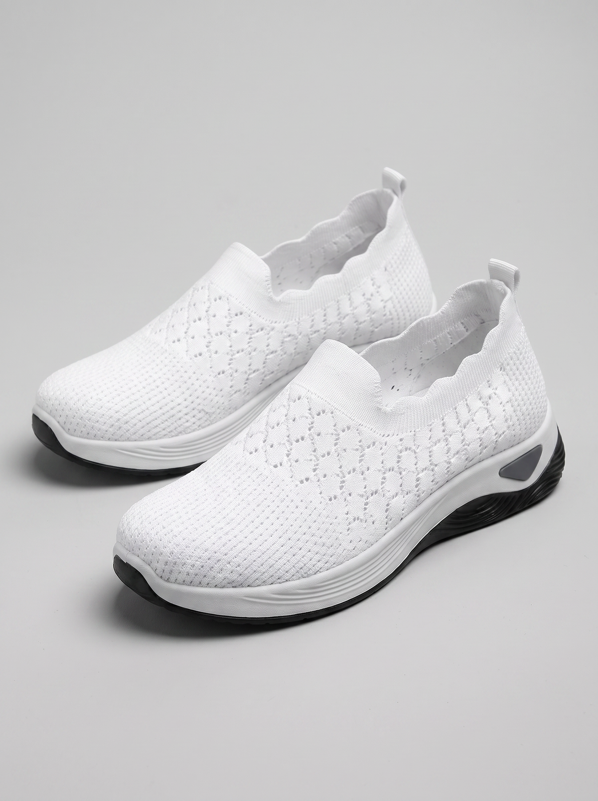 Remi Women's Ultra-Light Slip-On in white, three-quarter front view