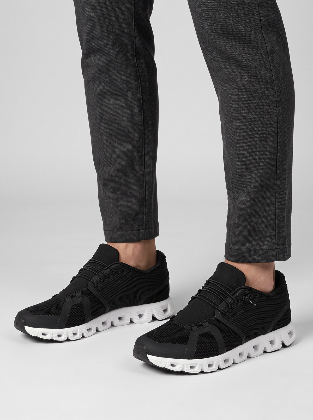 Drift Men's Slip-On Sneakers in black and white, worn on the foot