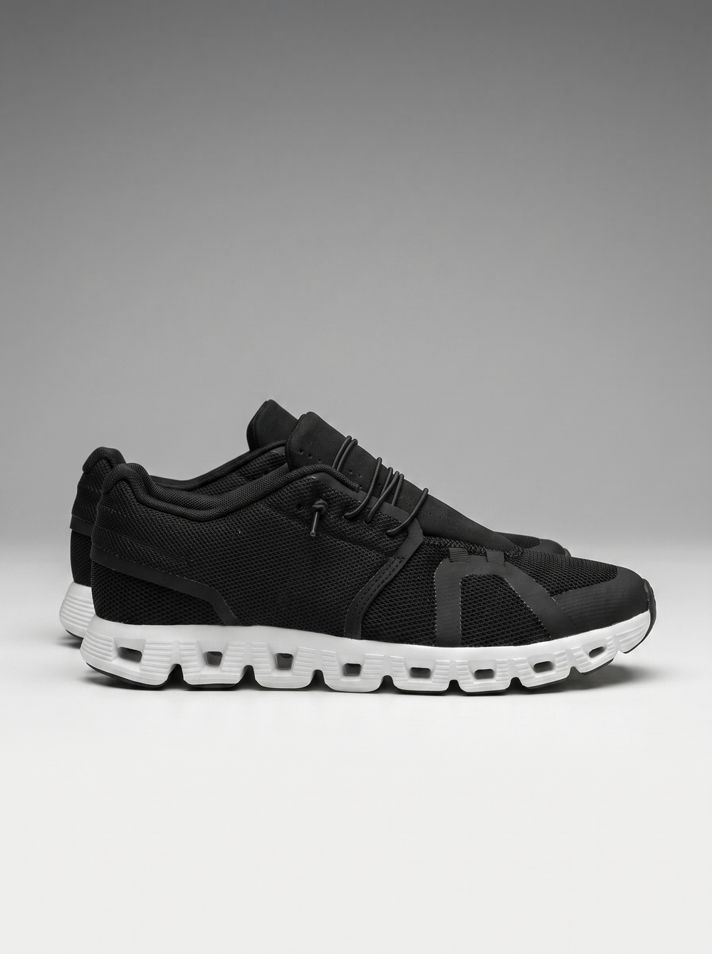 Drift Men's Slip-On Sneakers in black and white, side profile view