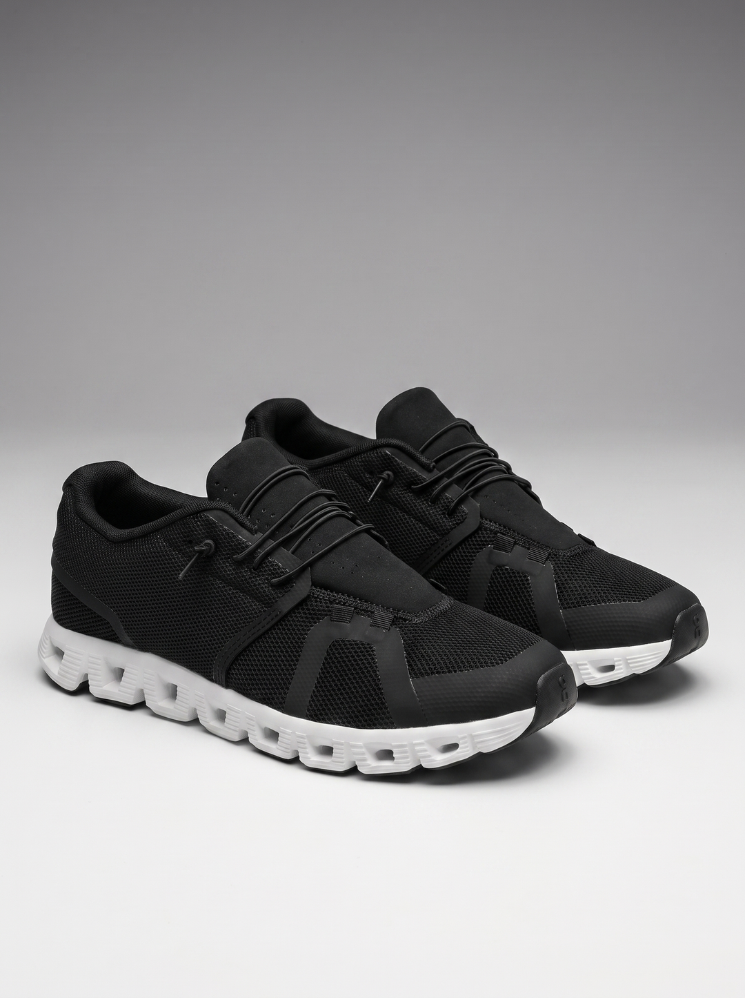 Drift Men's Slip-On Sneakers in black and white, three-quarter front view