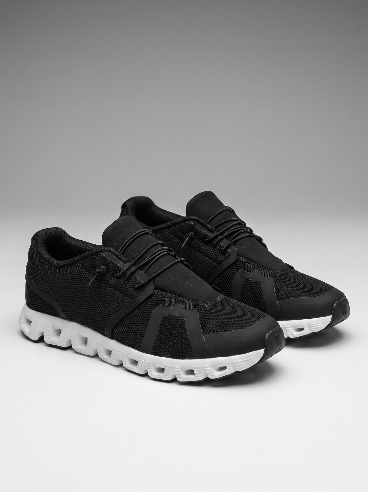 Drift Men's Slip-On Sneakers in black and white, three-quarter front view