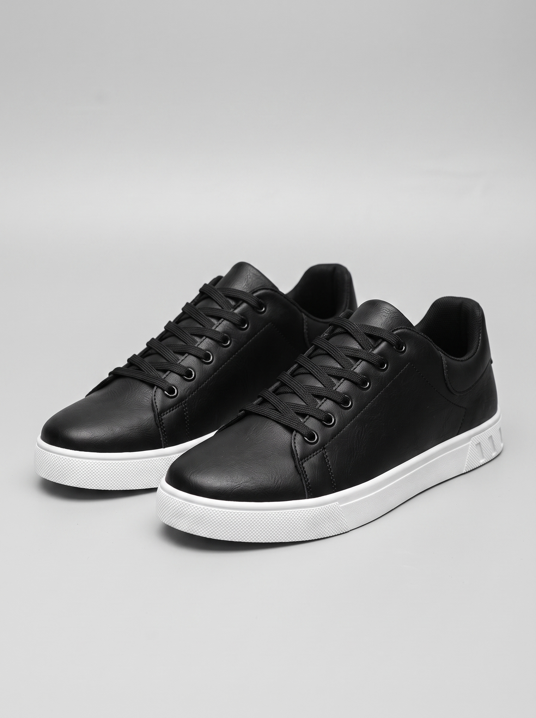Contrast Men's Lace-Up Sneakers in black, three-quarter front view