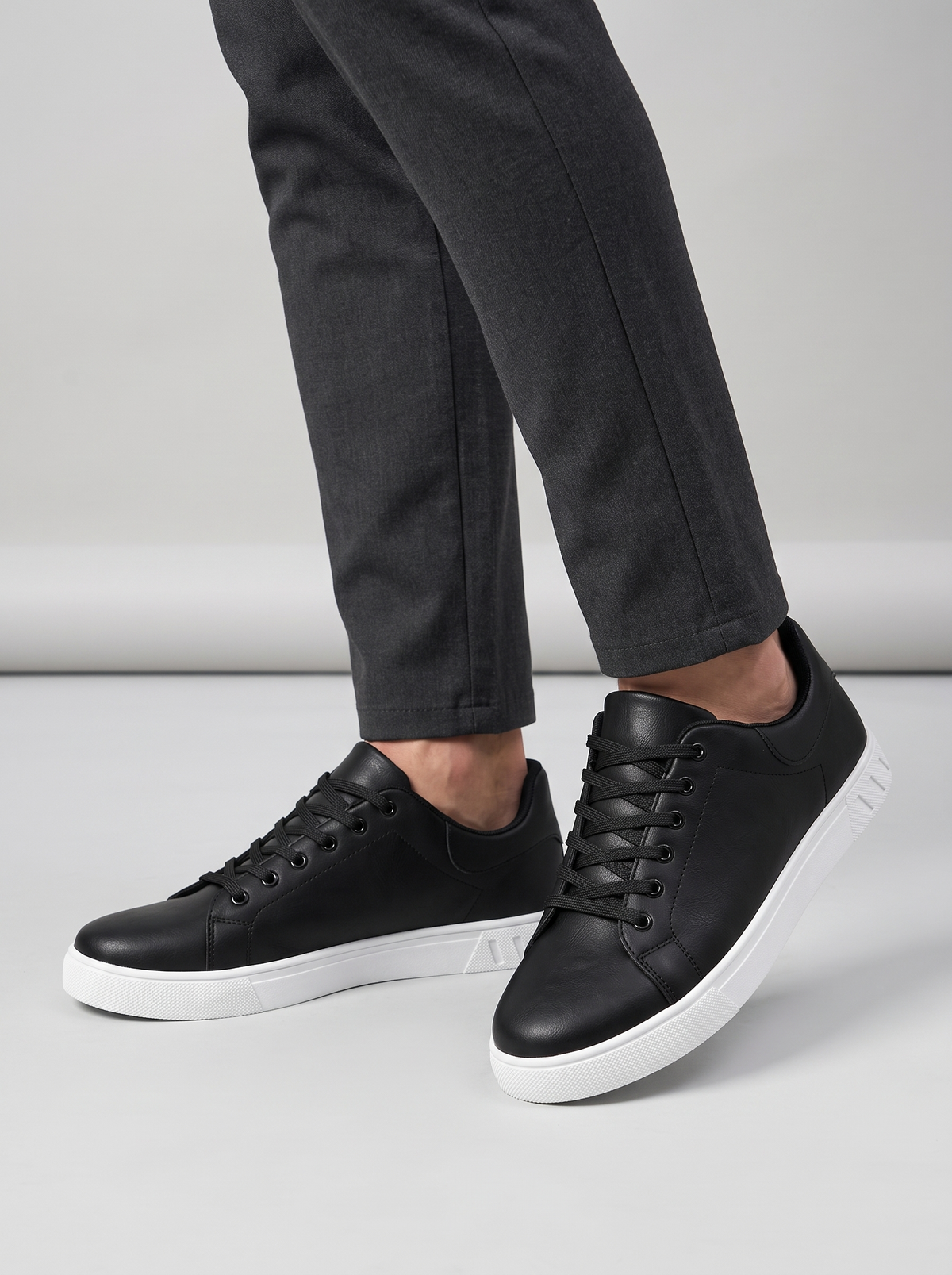 Contrast Men's Lace-Up Sneakers in black, worn on the foot