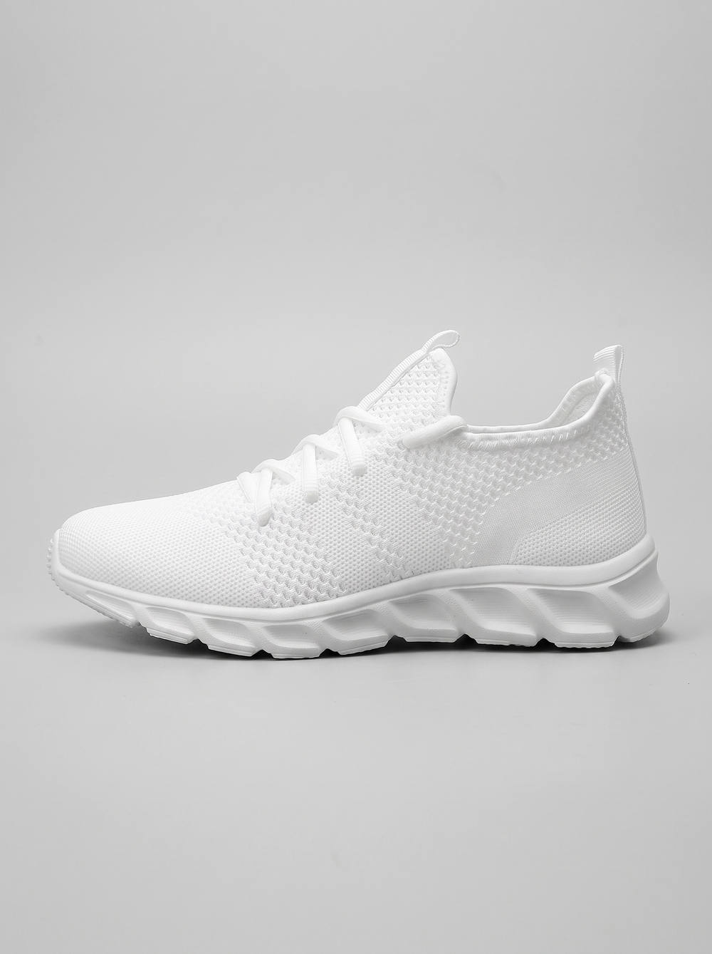 Mesh witte hardloopschoen zijaanzicht