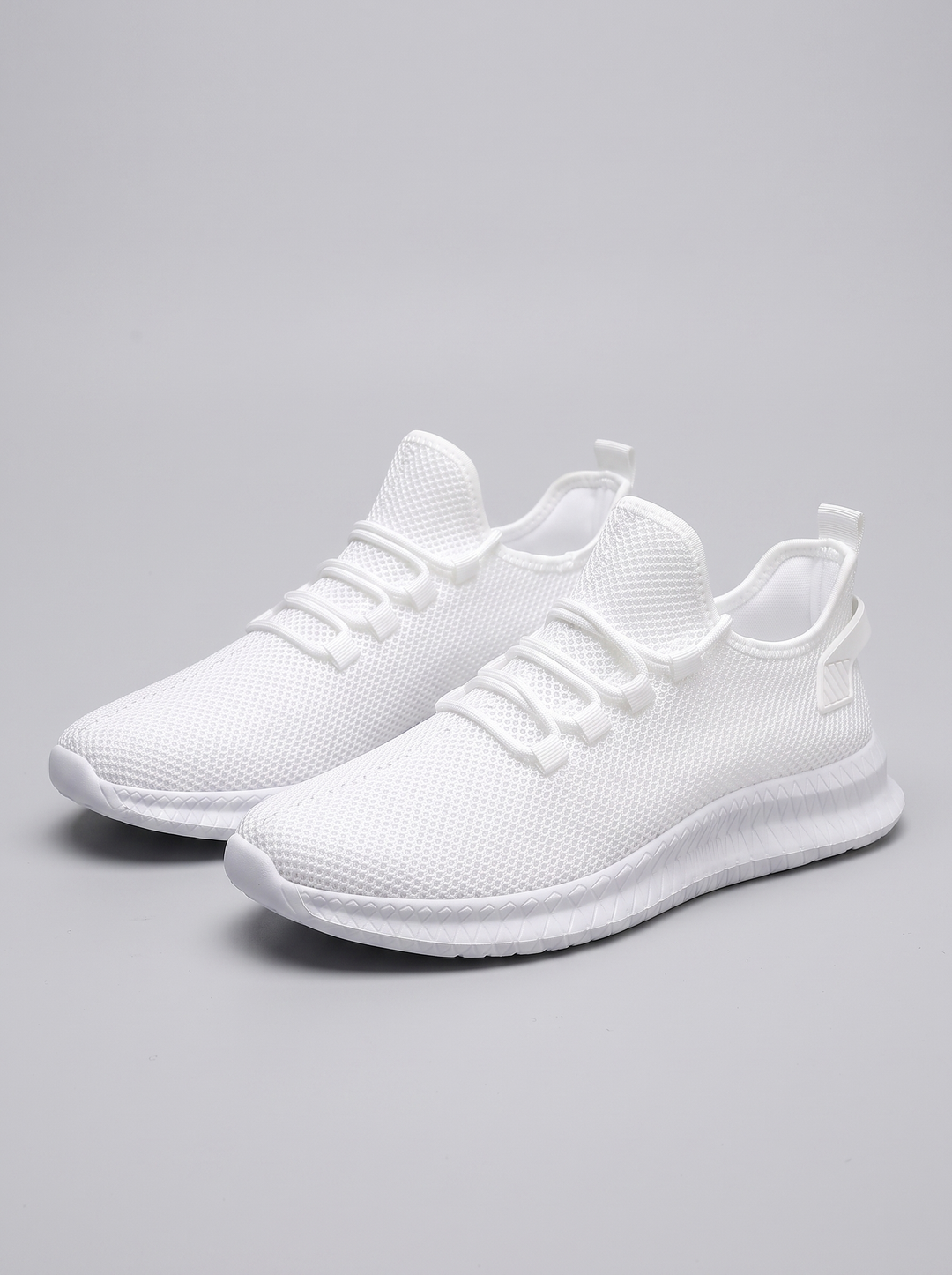 Run witte hardloopschoenen paar driekwart