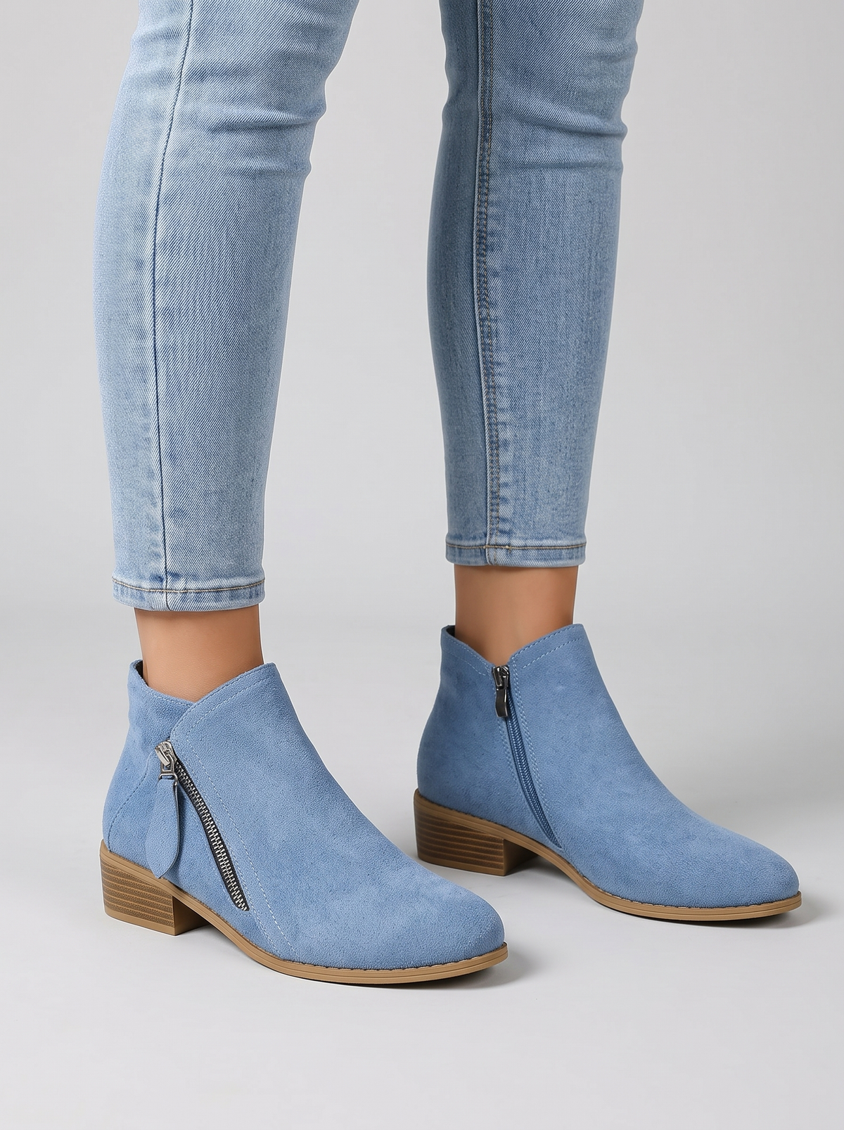 Colleen blue suede ankle boots worn with cropped jeans