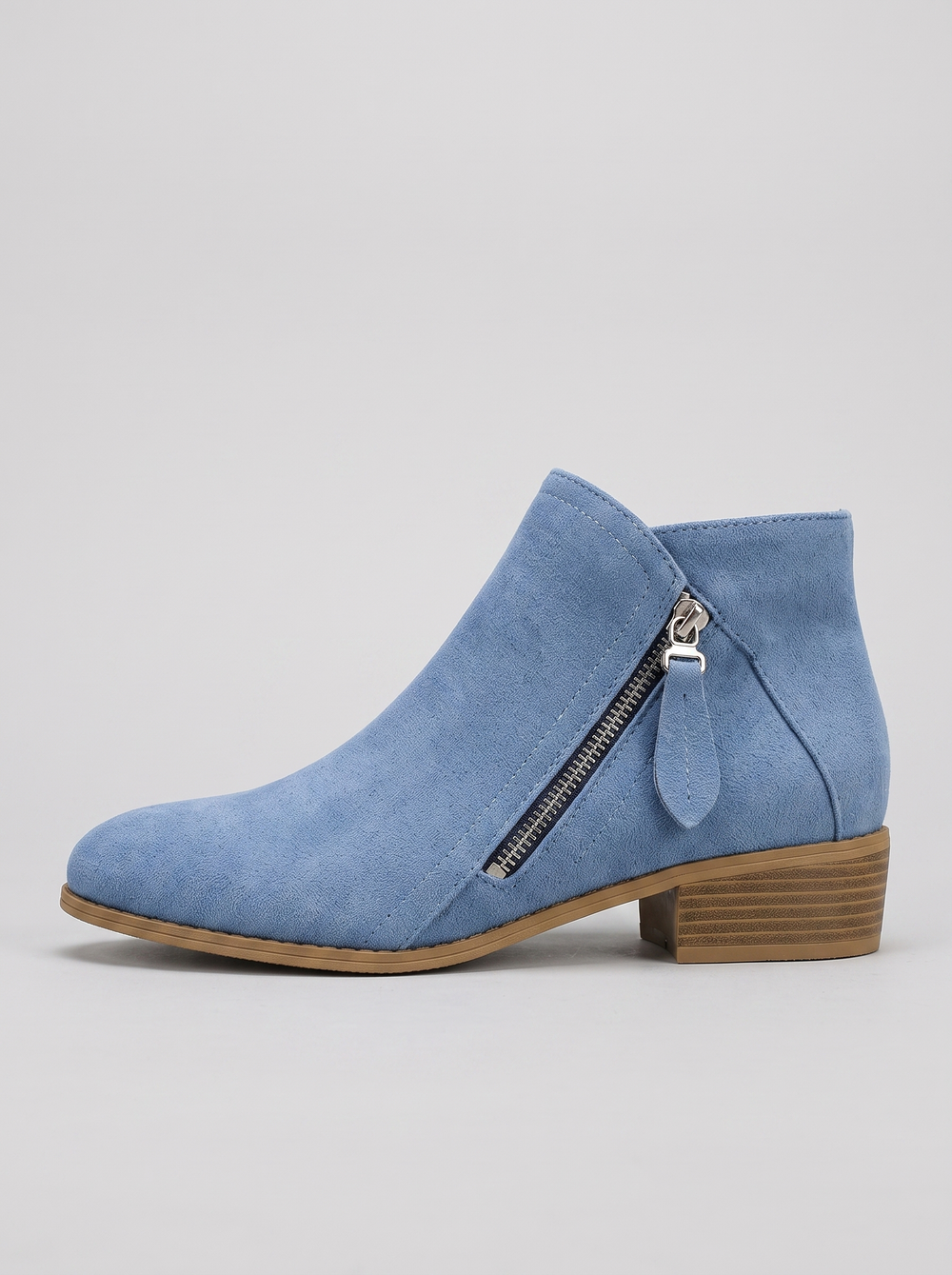 Colleen blue suede ankle boot side profile showing the silver side zipper