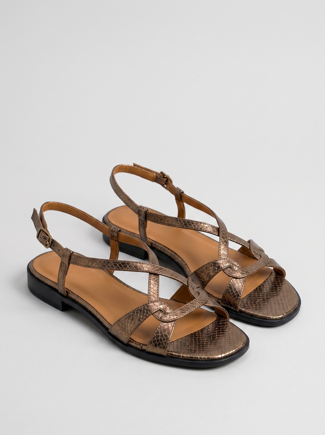 Stella women's snake-pattern slingback sandals, pair, three-quarter view